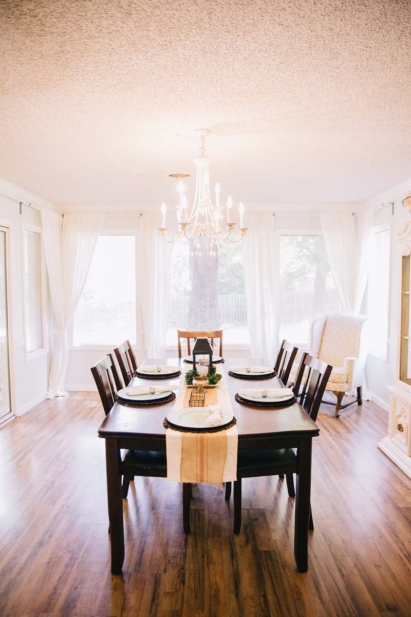 interior design rectangular brown wooden table with tabled near window indoors